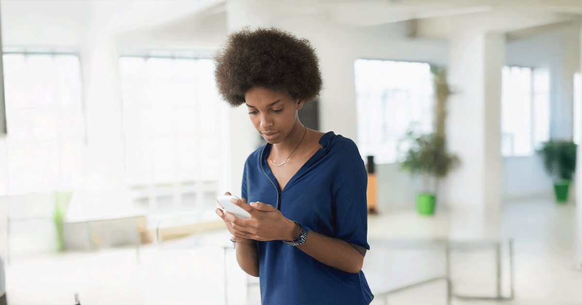 Woman researching facts about medical abortion on her phone.